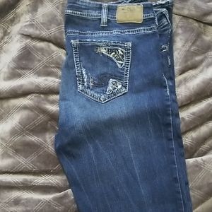 Silver jeans with distressing